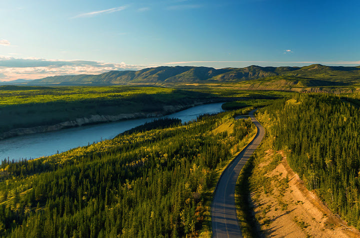 Beautiful shot from the sky of the northwest territories with trees and a lake below