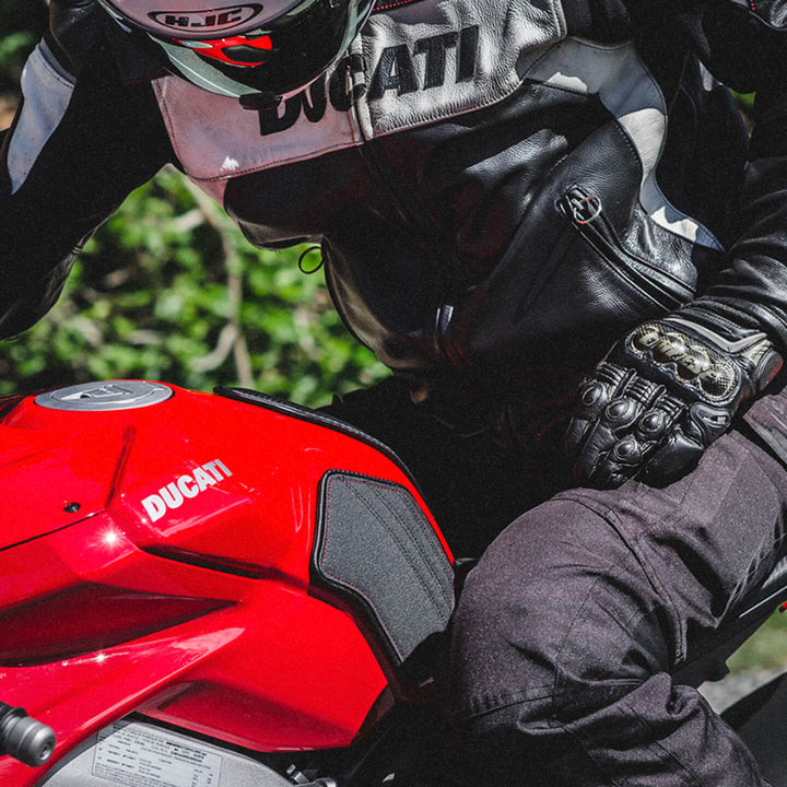Biker sitting on Ducati with attached Luimoto tank grips